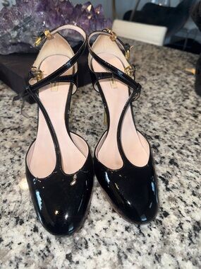 Miu Miu Black Patent T-Strap Heels with Gold Buckles